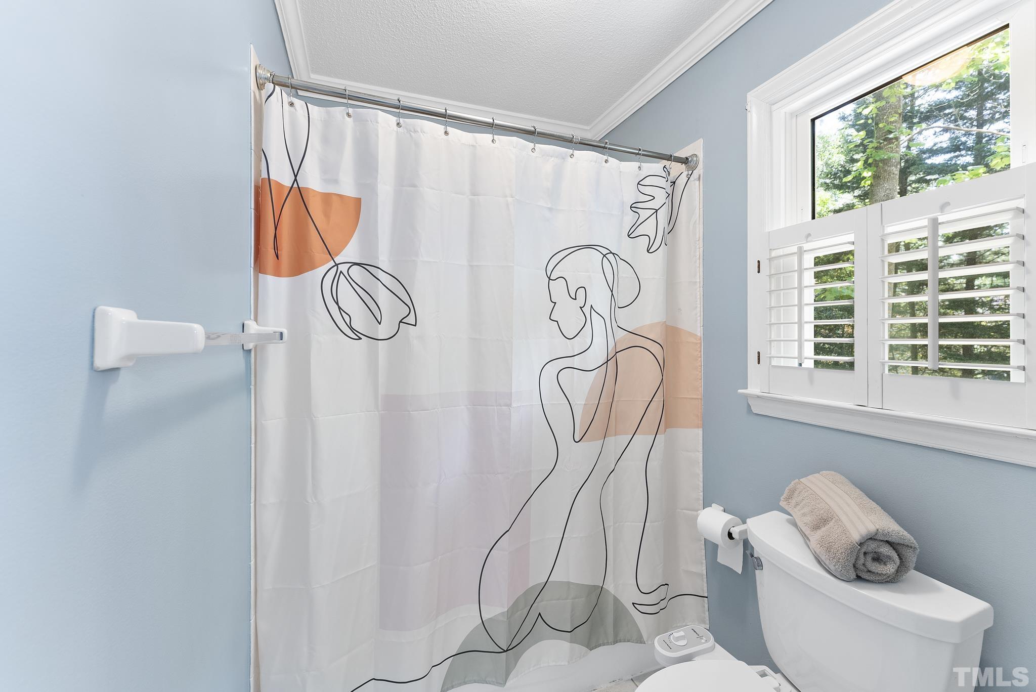 4205 Pleasant Grove Church Road Raleigh, NC 27613 - Photo 16 of 34 a bathroom with a window and a shower