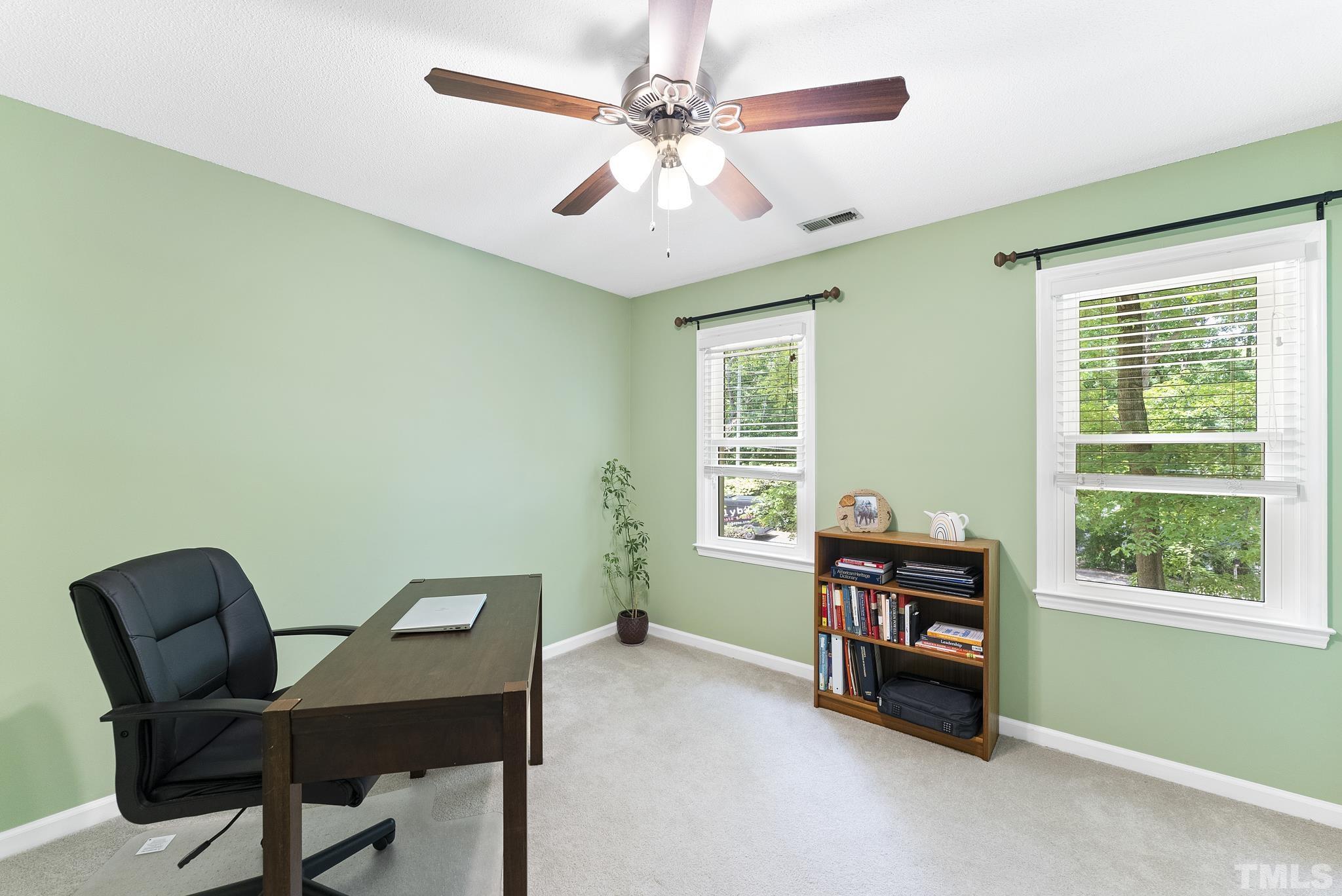 4205 Pleasant Grove Church Road Raleigh, NC 27613 - Photo 20 of 34 a livingroom with a workspace