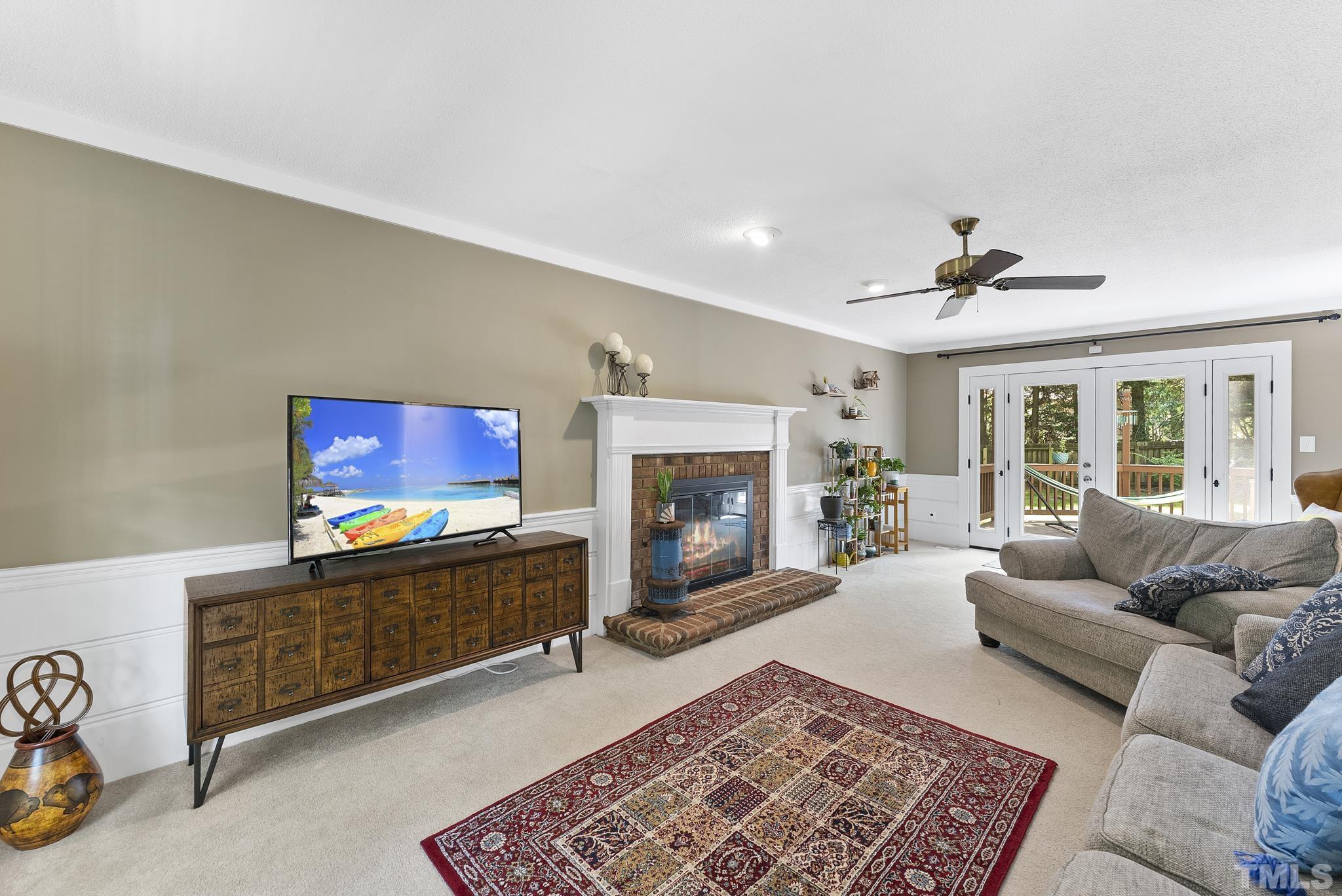 4205 Pleasant Grove Church Road Raleigh, NC 27613 - Photo 2 of 34 a living room with furniture and a fireplace