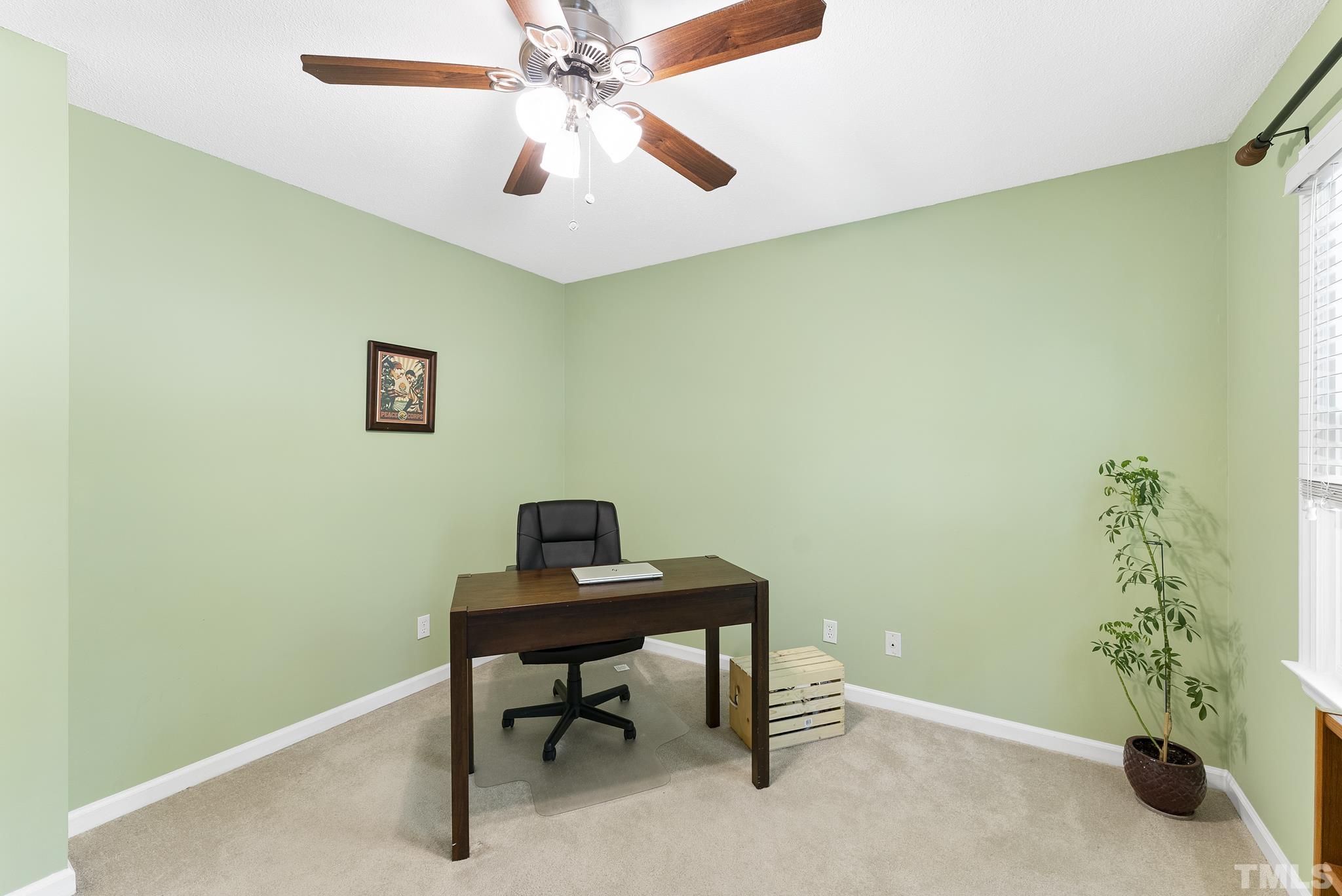 4205 Pleasant Grove Church Road Raleigh, NC 27613 - Photo 21 of 34 a view of a workspace with furniture and a chandelier fan