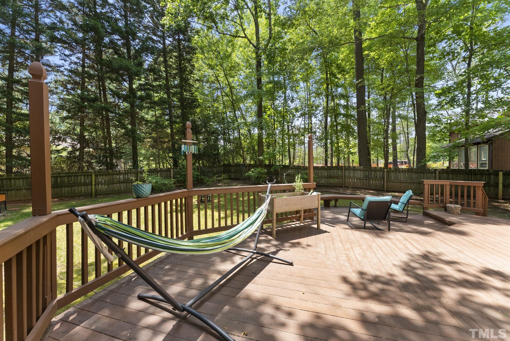 4205 Pleasant Grove Church Road Raleigh, NC 27613 - Photo 23 of 34 a view of swimming pool with chairs and wooden fence