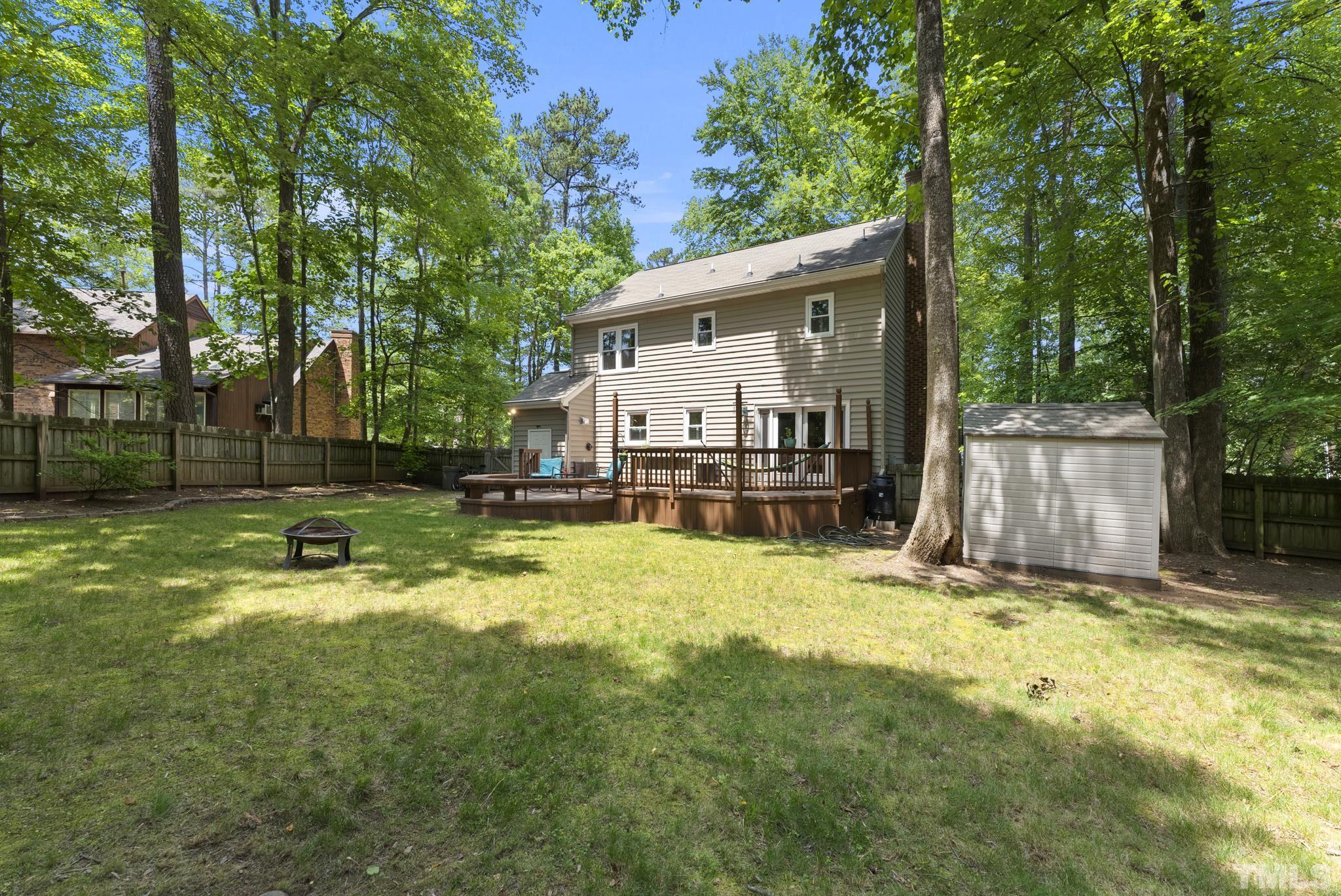 4205 Pleasant Grove Church Road Raleigh, NC 27613 - Photo 30 of 34 front view of a house with a yard patio and a slide