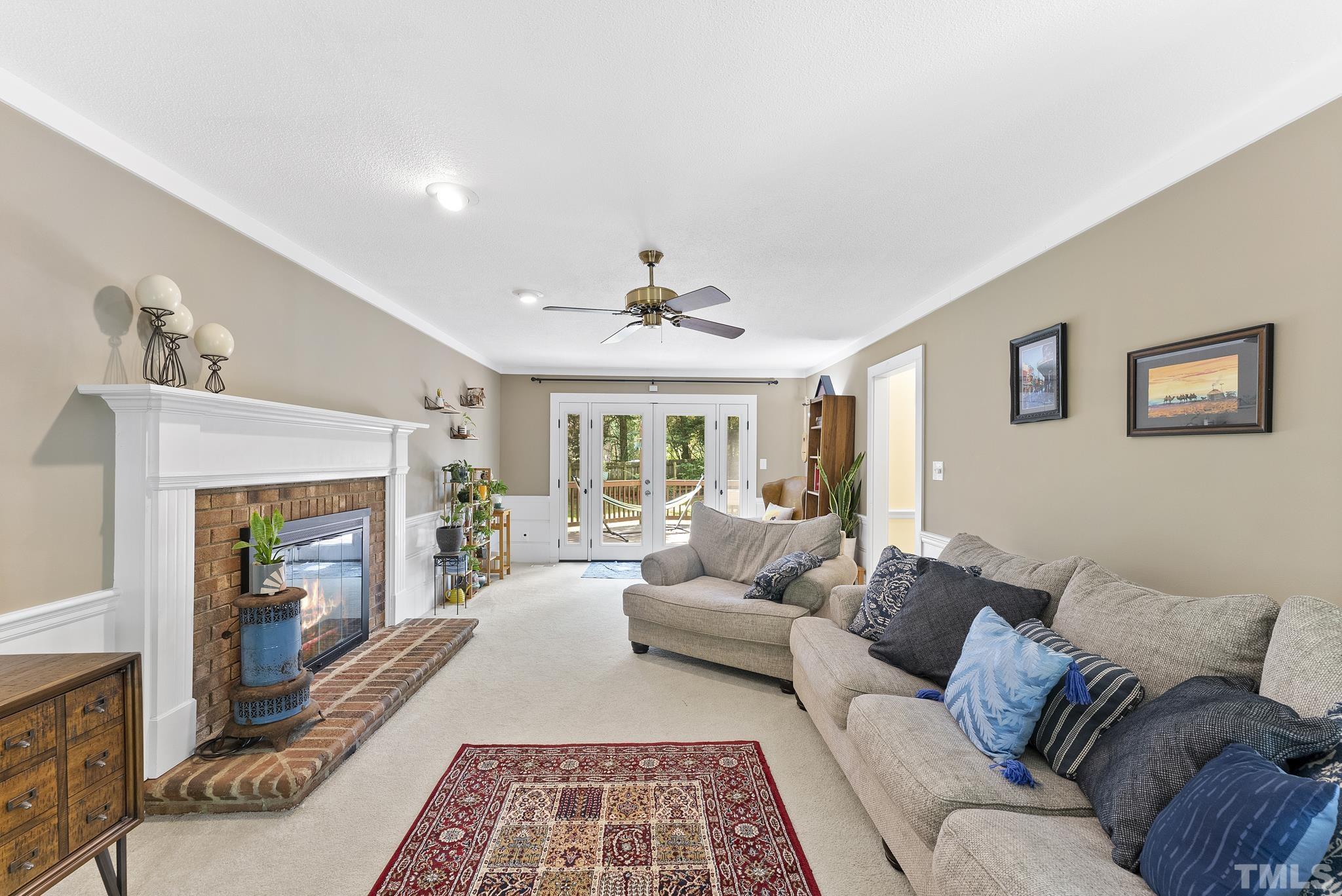 4205 Pleasant Grove Church Road Raleigh, NC 27613 - Photo 3 of 34 a living room with furniture and a fireplace