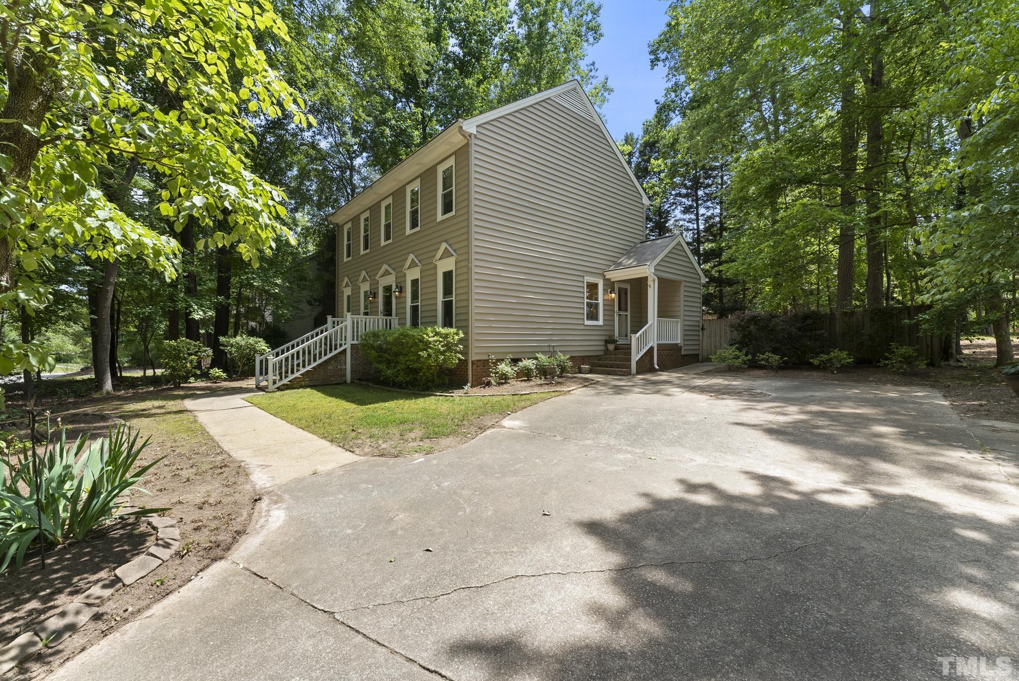 4205 Pleasant Grove Church Road Raleigh, NC 27613 - Photo 32 of 34 a view of a house with backyard and trees