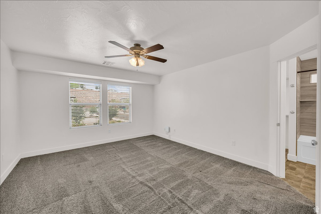 5875 Challenger Way St. George, UT 84790 - Photo 9 of 18 Carpeted room with two windows featuring horizontal blinds