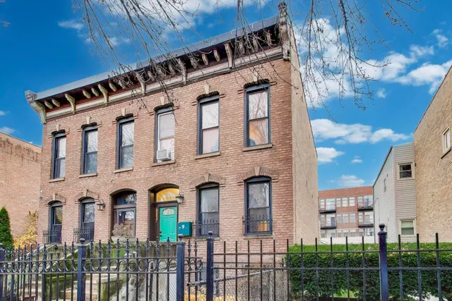 a front view of a building with glass windows