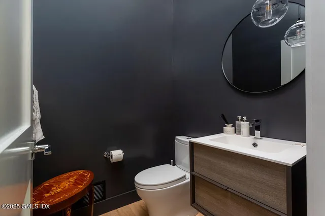 a bathroom with a toilet and a sink
