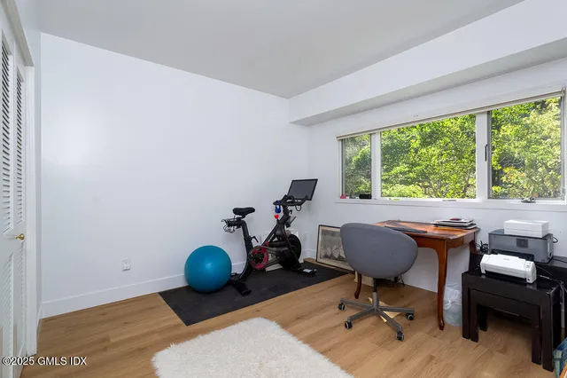 a workspace with furniture and a window
