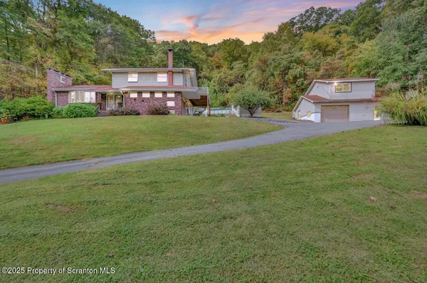 a view of a house with a big yard