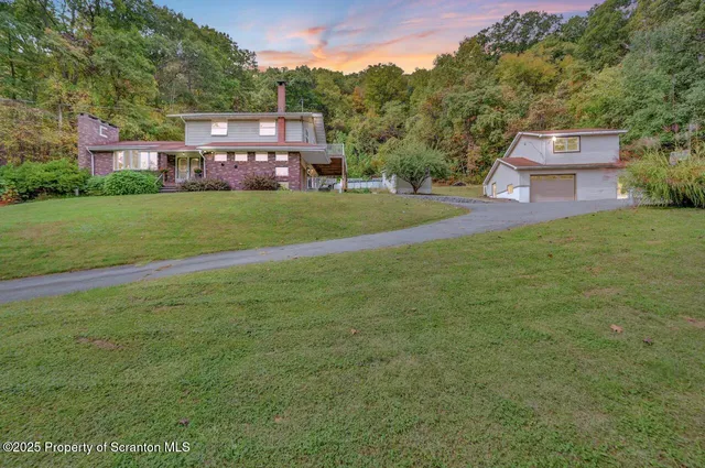 a view of a house with a big yard