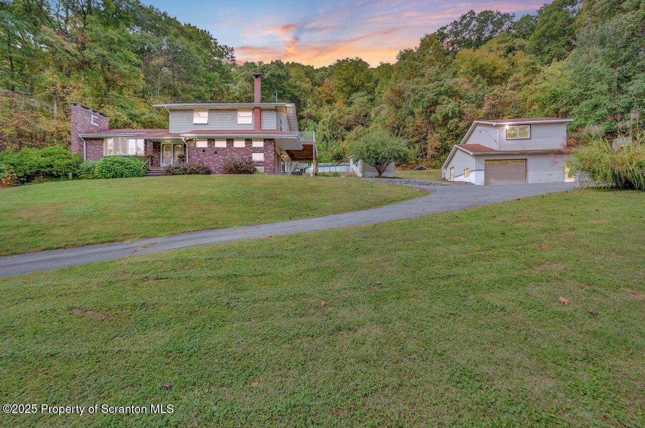 a view of a house with a big yard