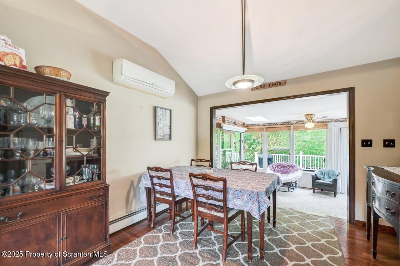 2352 Newton Ransom Boulevard Clarks Summit, PA 18411 - Photo 12 of 85 a dining room with furniture a chandelier and window