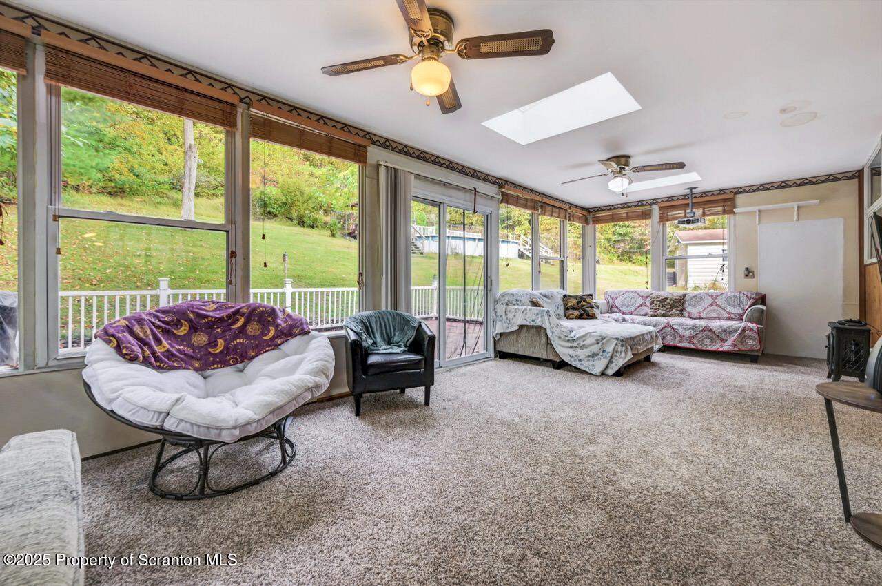 2352 Newton Ransom Boulevard Clarks Summit, PA 18411 - Photo 15 of 85 a living room with furniture and a floor to ceiling window