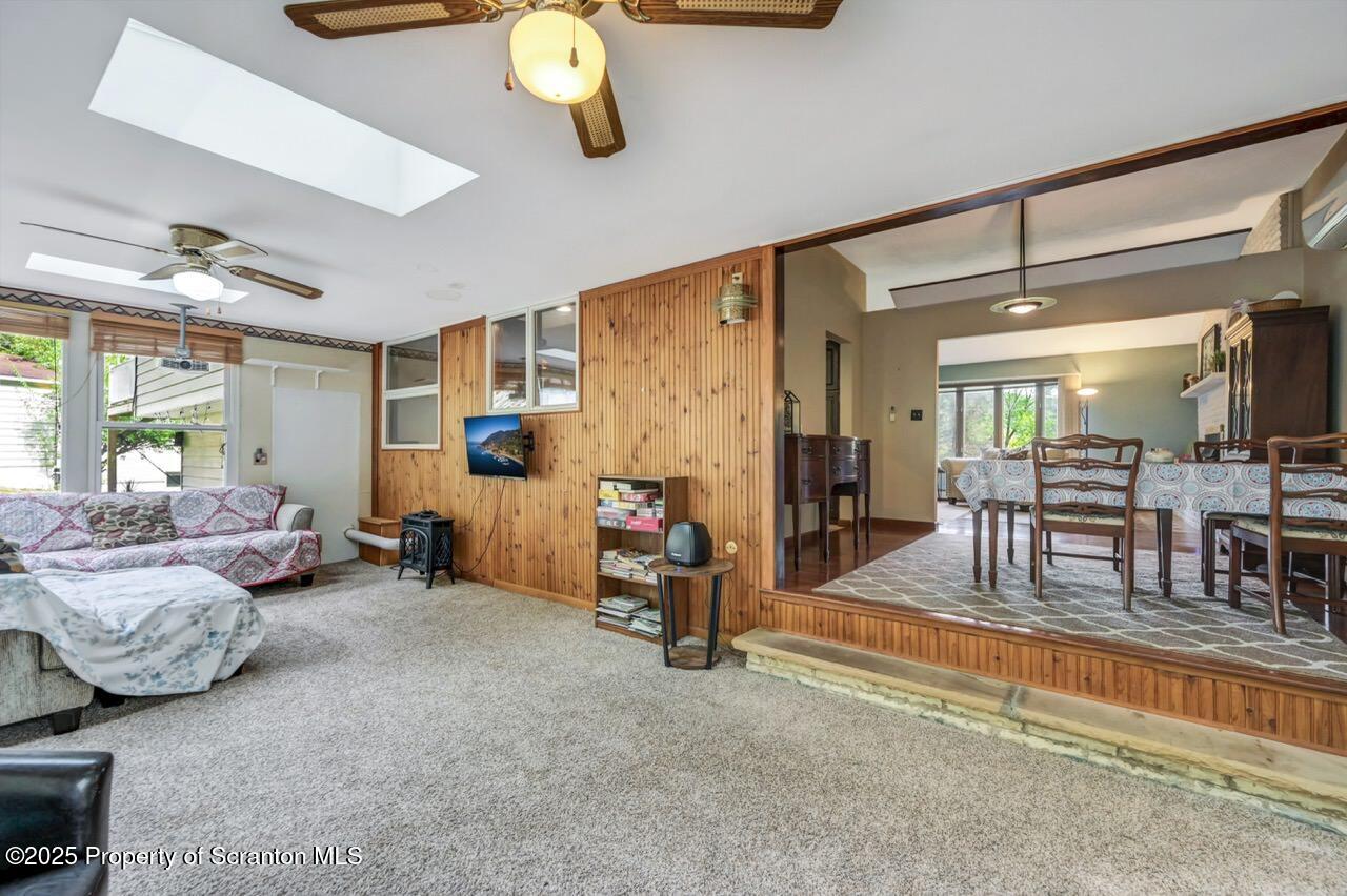 2352 Newton Ransom Boulevard Clarks Summit, PA 18411 - Photo 16 of 85 a living room with furniture and a floor to ceiling window