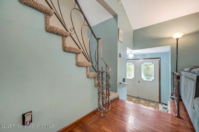 a bathroom with a toilet a sink and shower