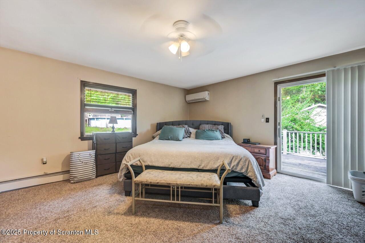 2352 Newton Ransom Boulevard Clarks Summit, PA 18411 - Photo 24 of 85 a bed sitting in a bedroom next to a window