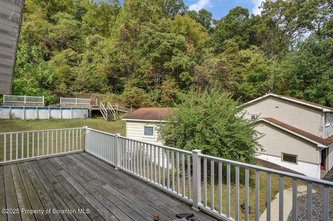 2352 Newton Ransom Boulevard Clarks Summit, PA 18411 - Photo 27 of 85 a view of a balcony with wooden floor and fence