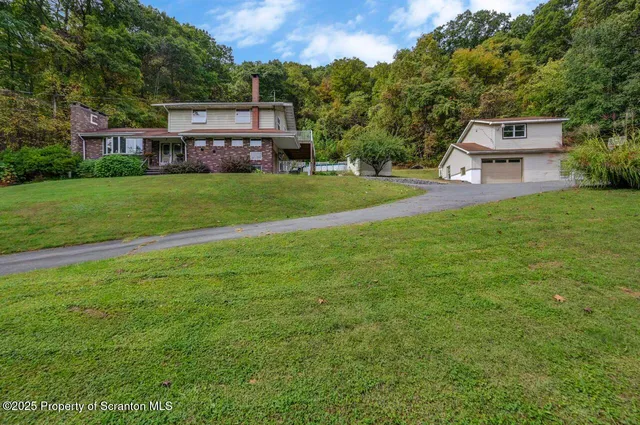 a view of a house with a big yard