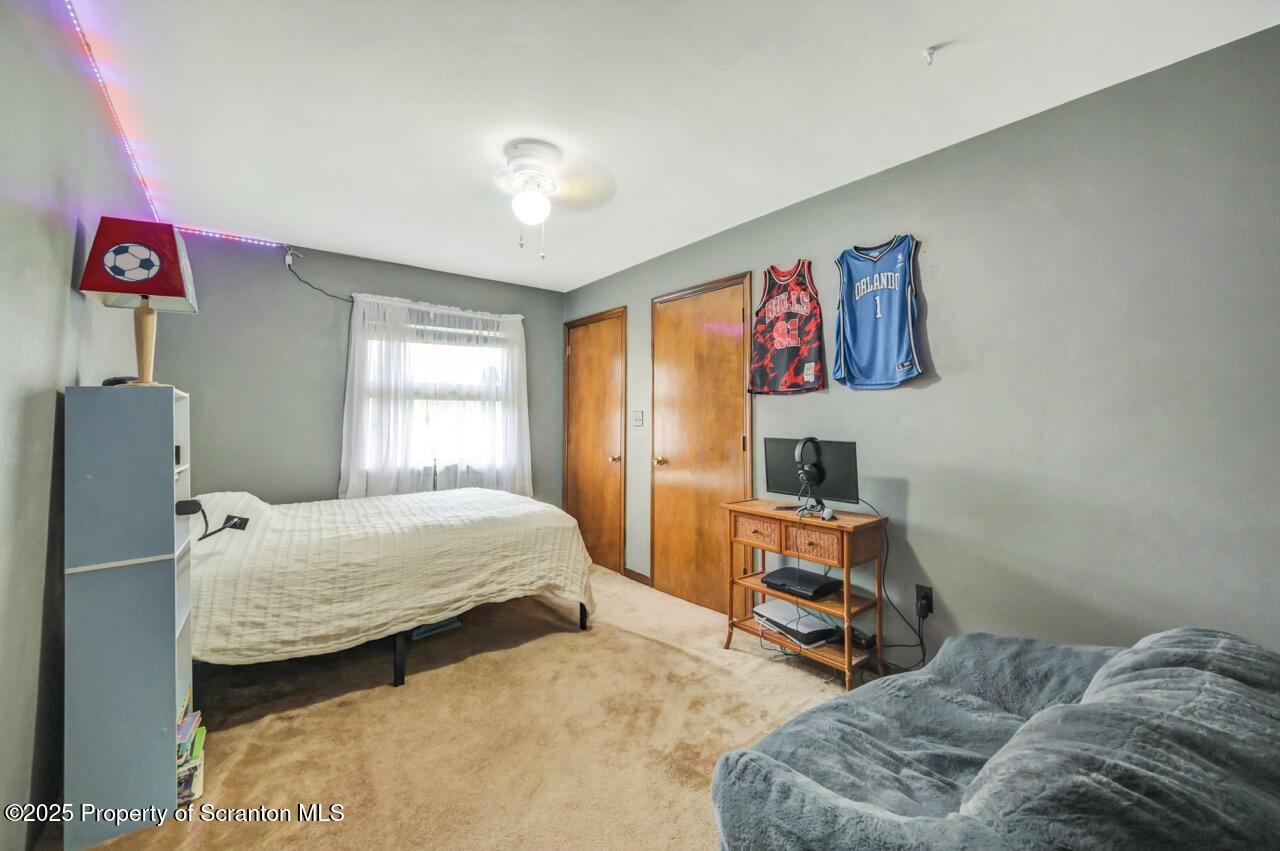 2352 Newton Ransom Boulevard Clarks Summit, PA 18411 - Photo 33 of 85 a bedroom with two beds and window