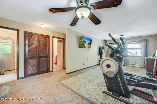 a view of an house with backyard space and balcony