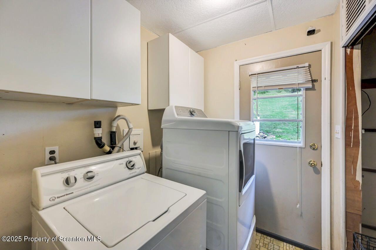 2352 Newton Ransom Boulevard Clarks Summit, PA 18411 - Photo 39 of 85 a kitchen with a refrigerator a stove and a window