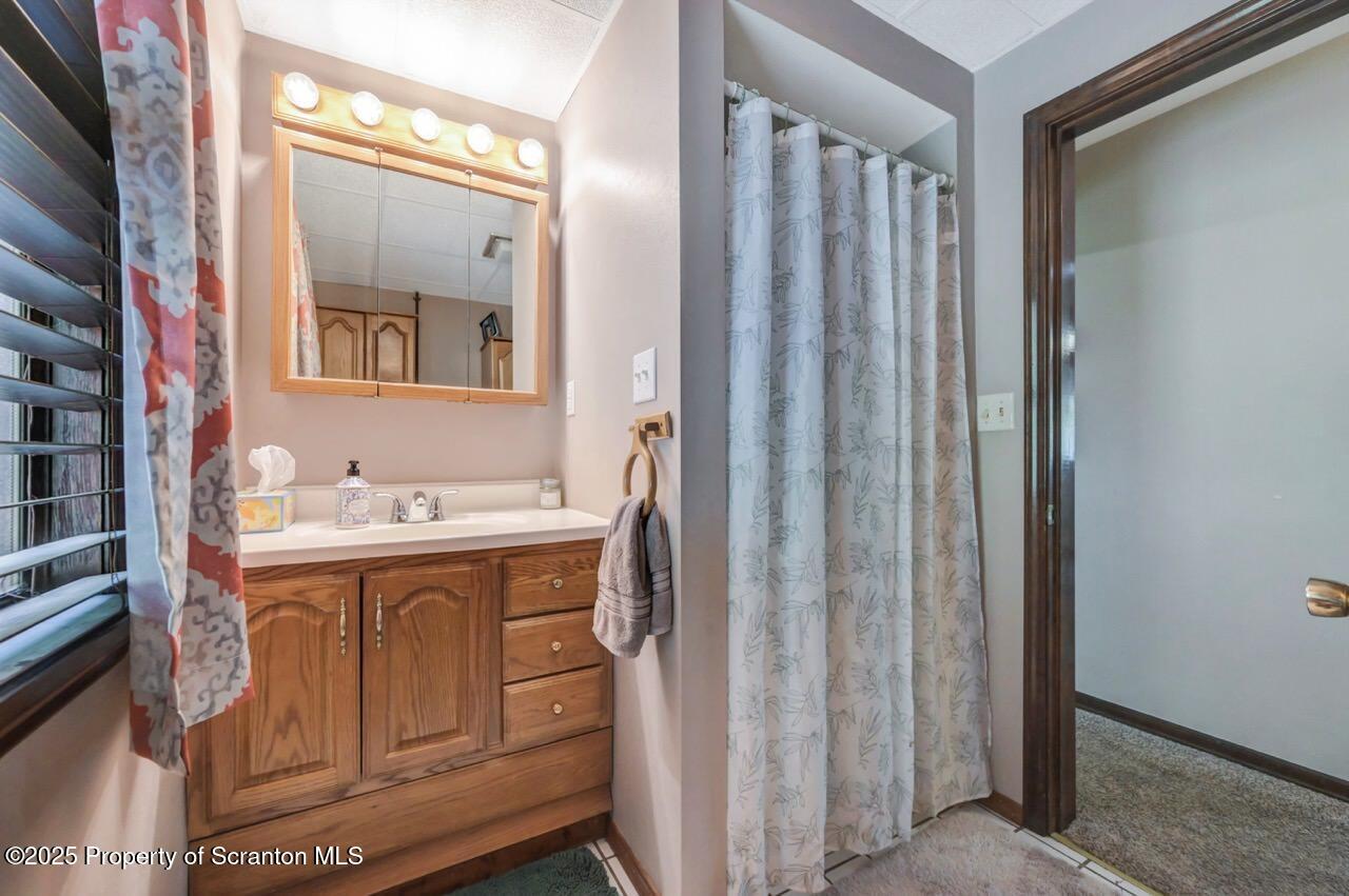2352 Newton Ransom Boulevard Clarks Summit, PA 18411 - Photo 43 of 85 a view of bathroom with a sink and mirror
