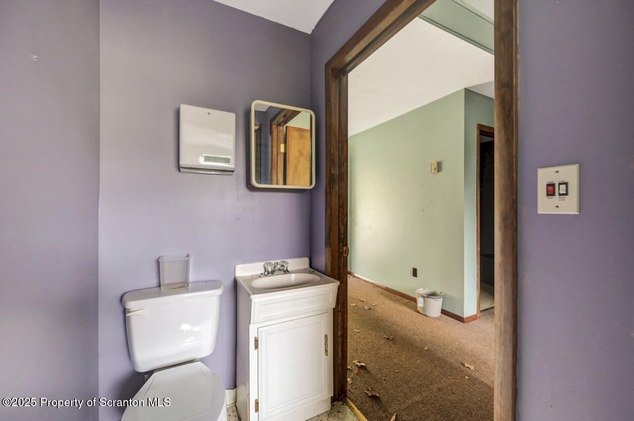 2352 Newton Ransom Boulevard Clarks Summit, PA 18411 - Photo 55 of 85 a bathroom with a toilet sink and mirror