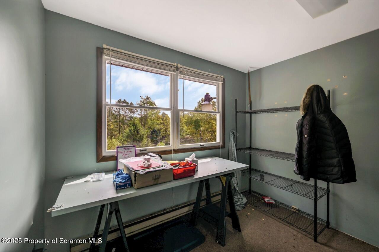 2352 Newton Ransom Boulevard Clarks Summit, PA 18411 - Photo 56 of 85 a room with a bed table and a window