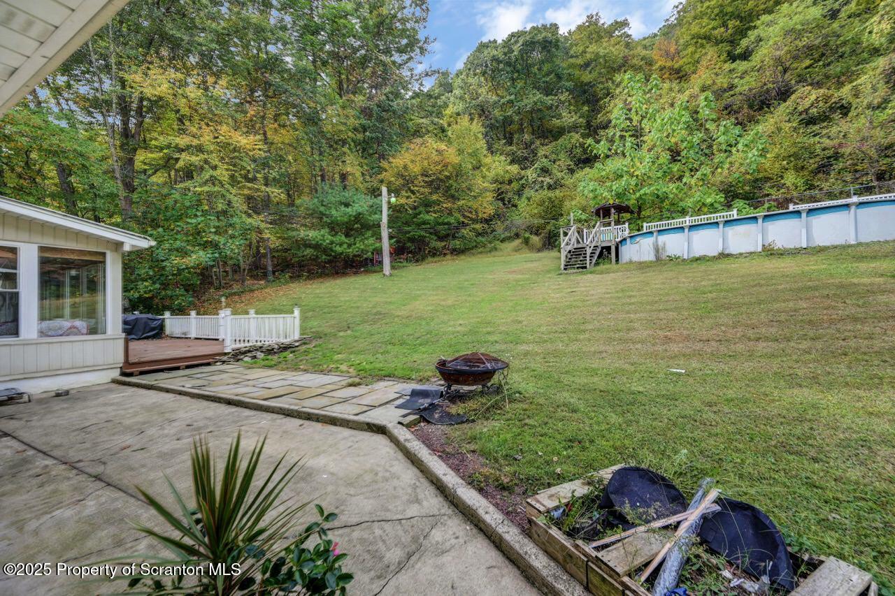 2352 Newton Ransom Boulevard Clarks Summit, PA 18411 - Photo 68 of 85 a view of a backyard with couches chair and a table and chairs