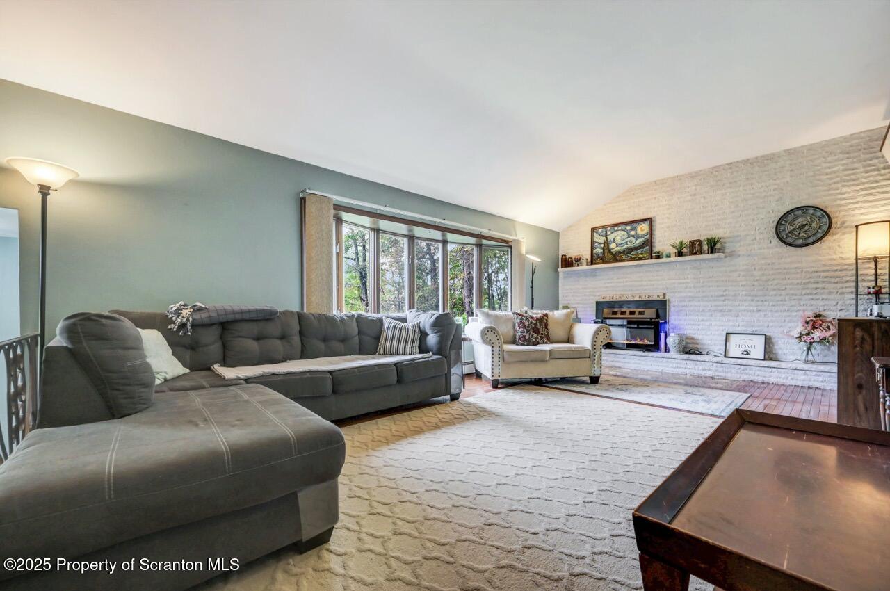 2352 Newton Ransom Boulevard Clarks Summit, PA 18411 - Photo 75 of 85 a living room with furniture and a large window