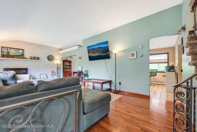 a dining room with furniture a chandelier and window