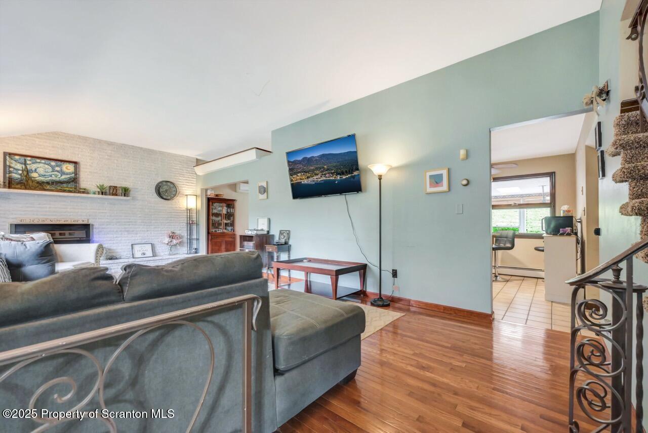 2352 Newton Ransom Boulevard Clarks Summit, PA 18411 - Photo 9 of 85 a living room with furniture and a flat screen tv