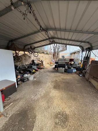 a view of a backyard with furniture