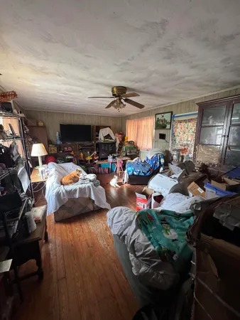 a living room with lots of furniture and a chandelier
