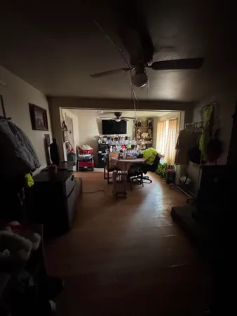 a living room with lots of furniture and a flat screen tv