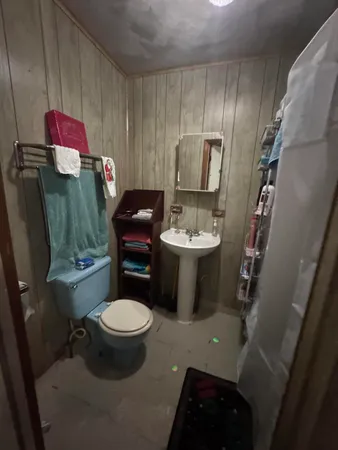 a bathroom with a toilet sink and tub