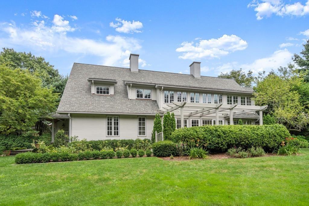 11 Clovelly Road Newton, MA 02467 - Photo 1 of 25 a front view of a house with a garden