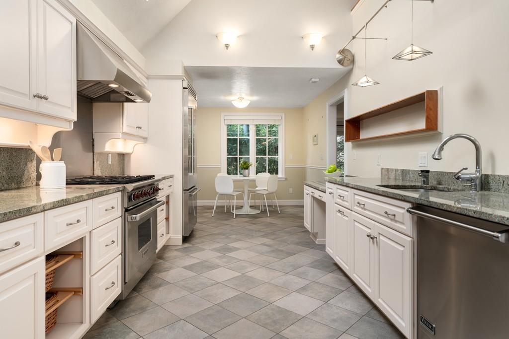 11 Clovelly Road Newton, MA 02467 - Photo 15 of 25 a large kitchen with stainless steel appliances lots of counter space sink and cabinets