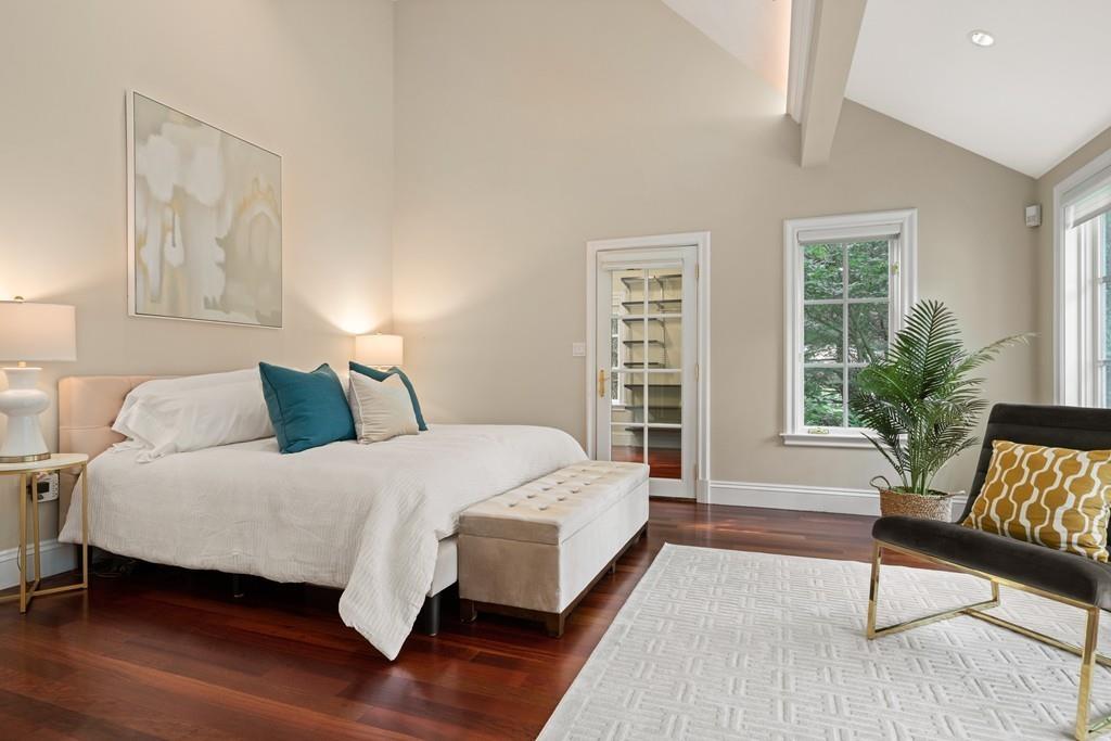 11 Clovelly Road Newton, MA 02467 - Photo 19 of 25 a spacious bedroom with a bed and a potted plant