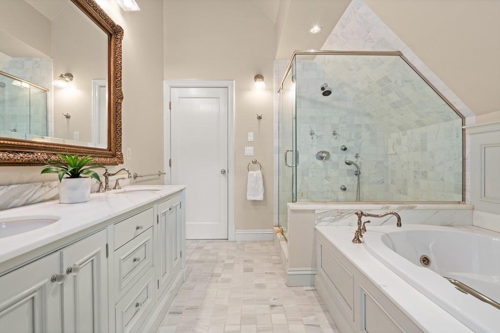 11 Clovelly Road Newton, MA 02467 - Photo 25 of 25 a spacious bathroom with a bathtub sink and mirror