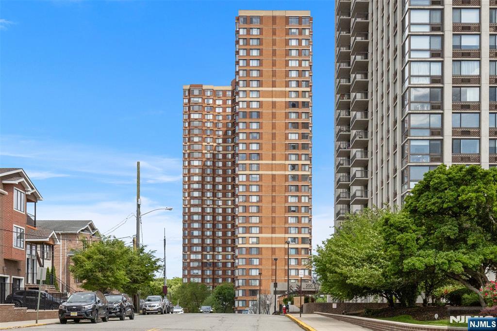 100 Old Palisade Road, Unit 3215 Fort Lee, NJ 07024 - Photo 1 of 43 a front view of a building with street view