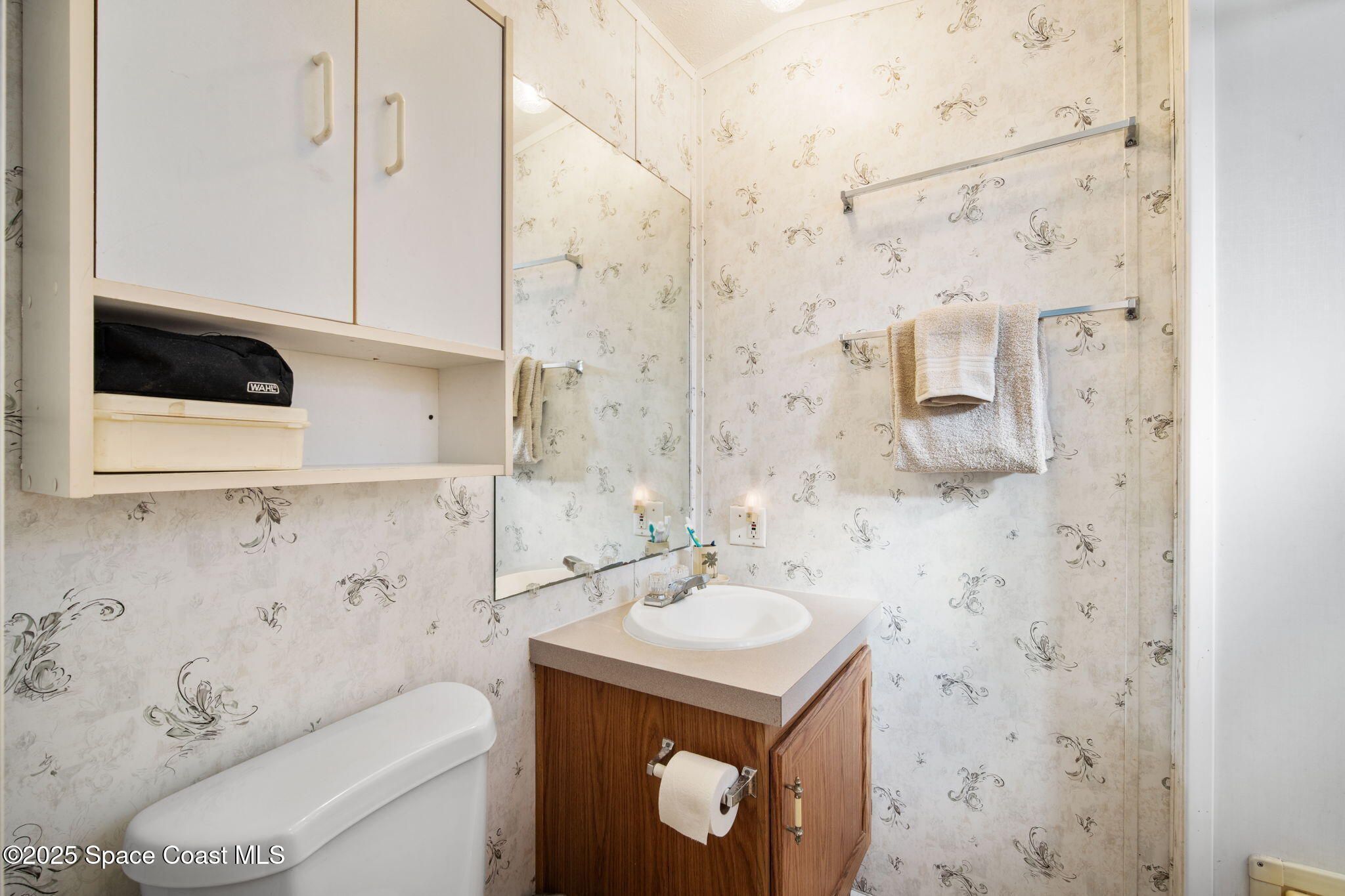 6672 Bear Trail Cocoa, FL 32926 - Photo 20 of 46 a bathroom with a sink toilet and shower