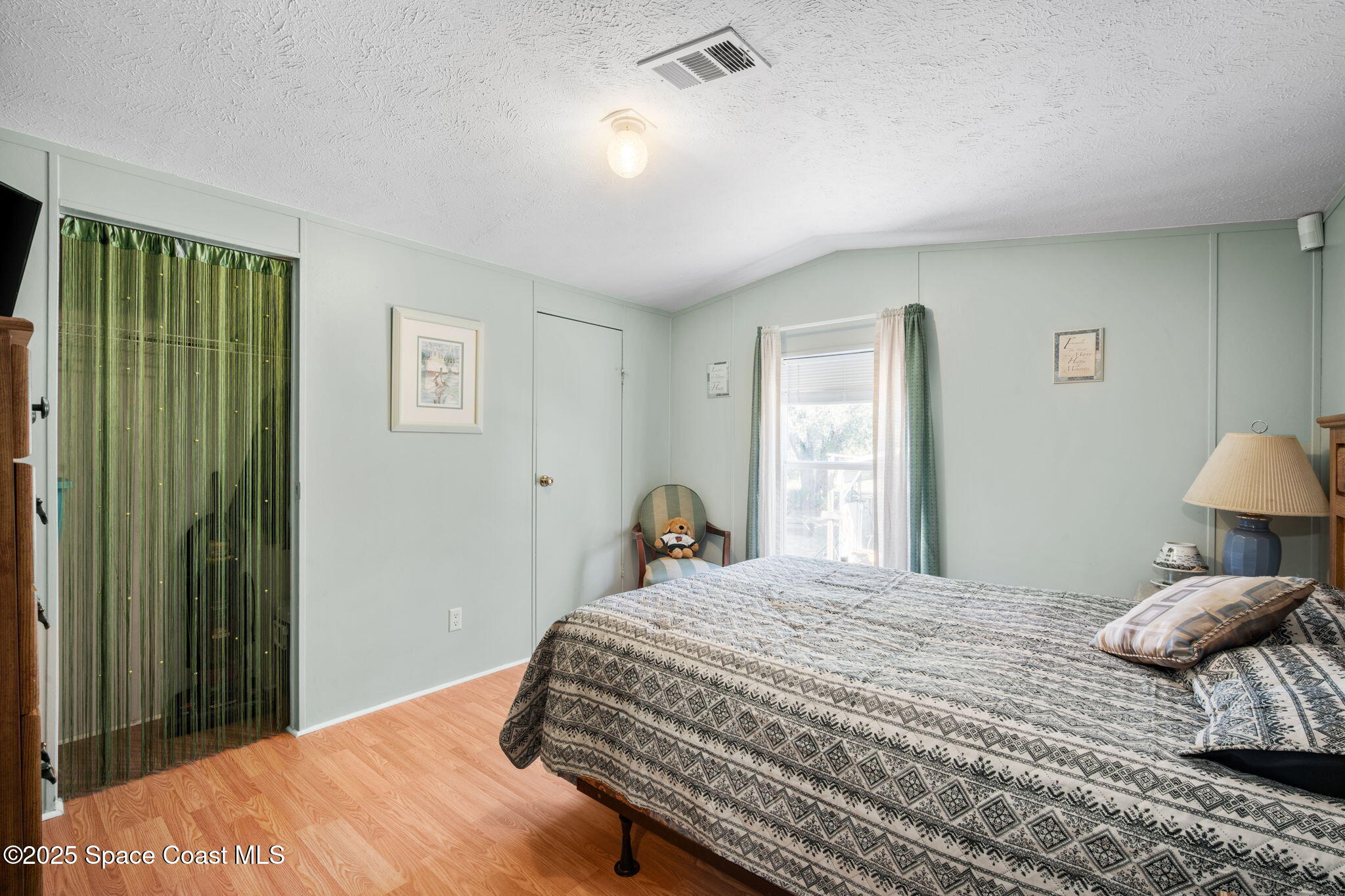 6672 Bear Trail Cocoa, FL 32926 - Photo 22 of 46 a bedroom with a bed and a window