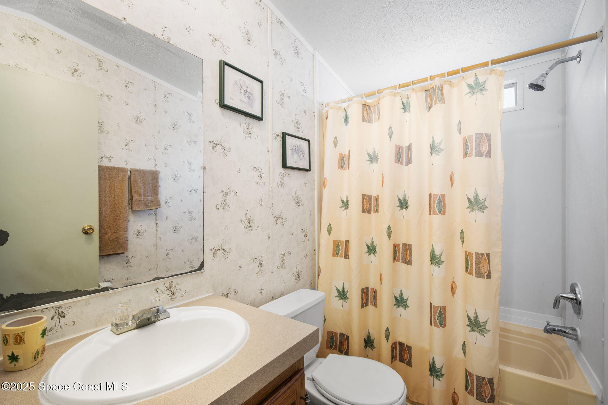 6672 Bear Trail Cocoa, FL 32926 - Photo 24 of 46 a bathroom with a sink toilet and shower