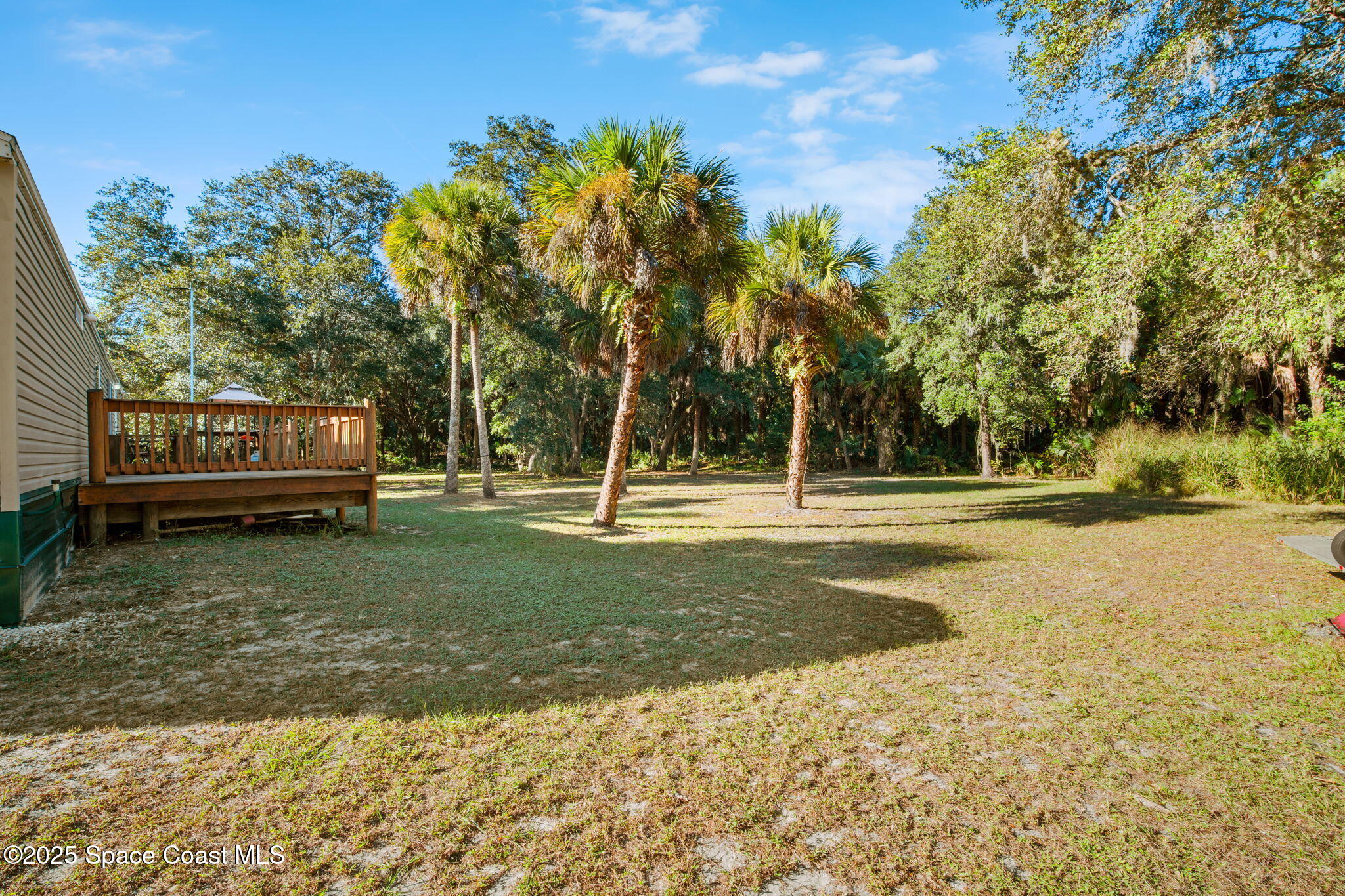 6672 Bear Trail Cocoa, FL 32926 - Photo 32 of 46 a view of a house with a yard