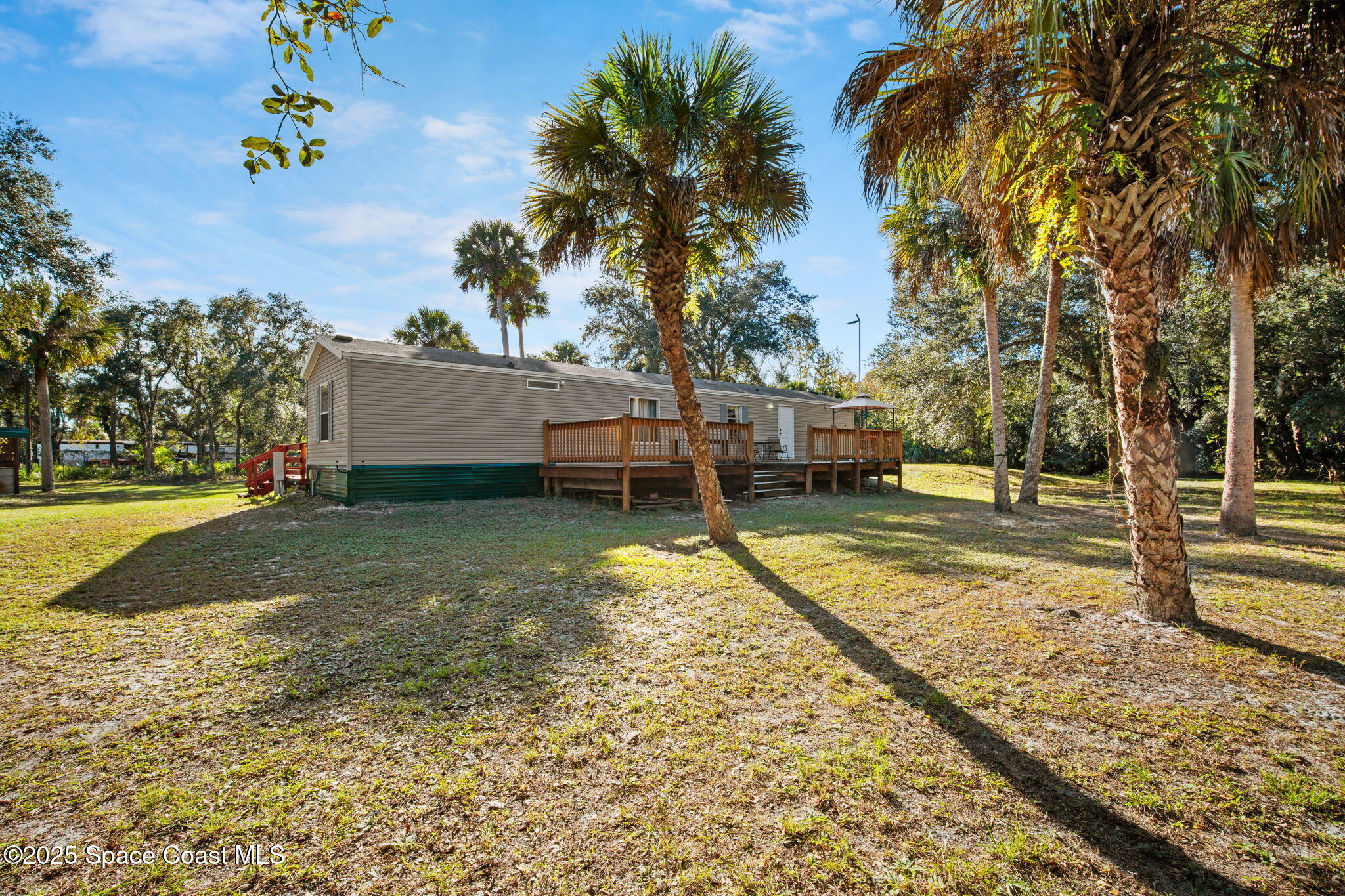 6672 Bear Trail Cocoa, FL 32926 - Photo 33 of 46 a view of a house with backyard and trees