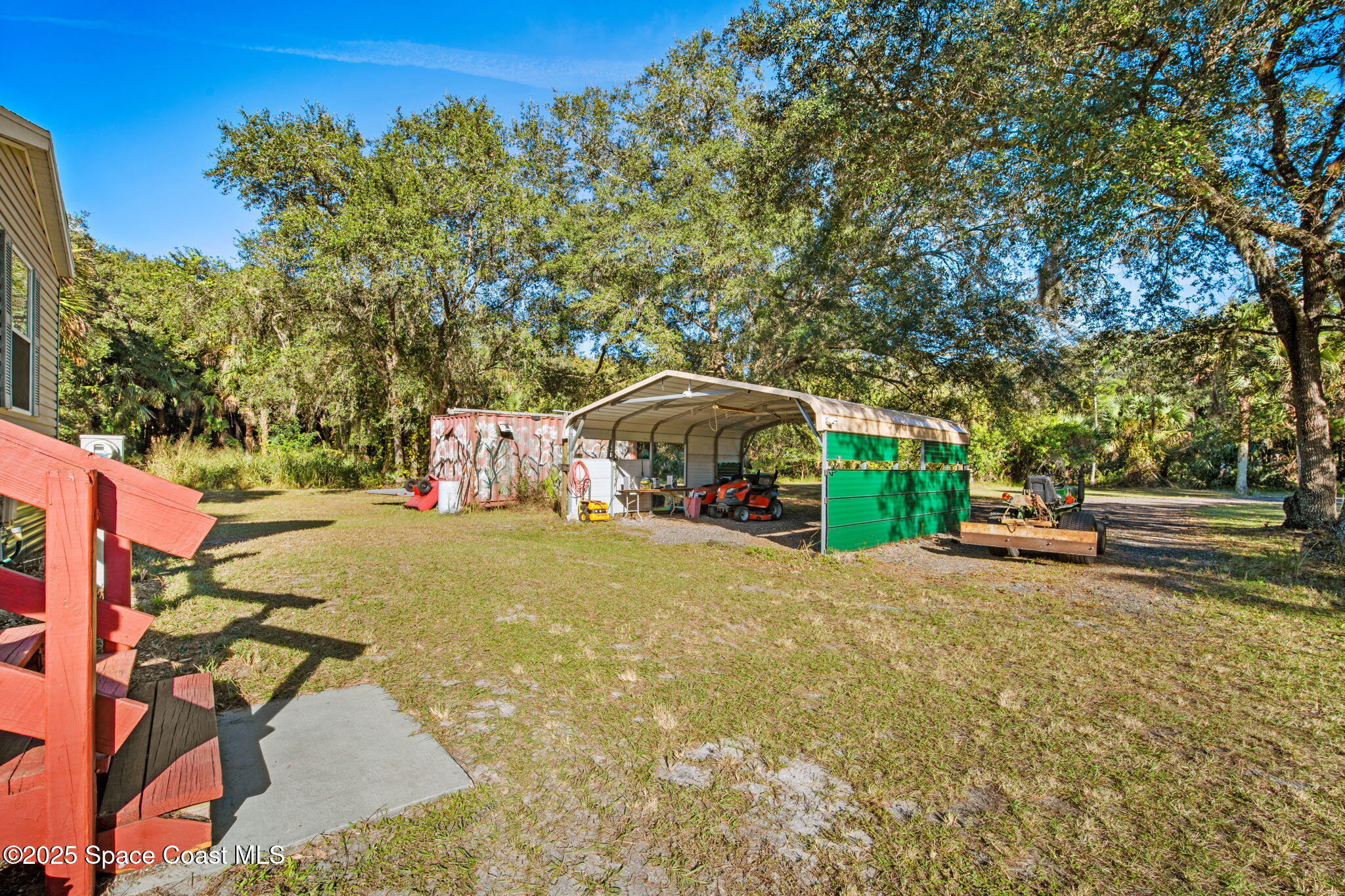 6672 Bear Trail Cocoa, FL 32926 - Photo 35 of 46 a yellow house with trees in front of it