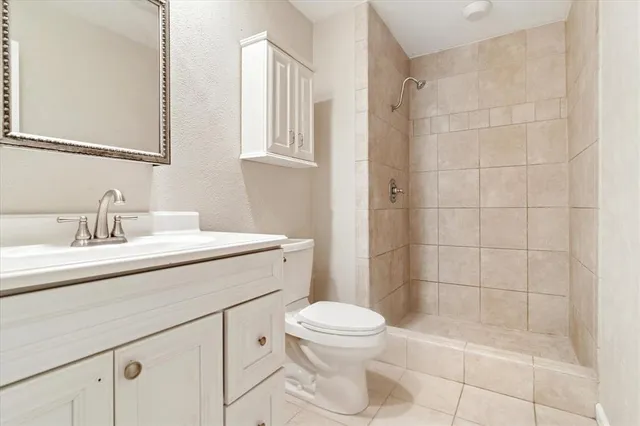 an empty room with windows and city view