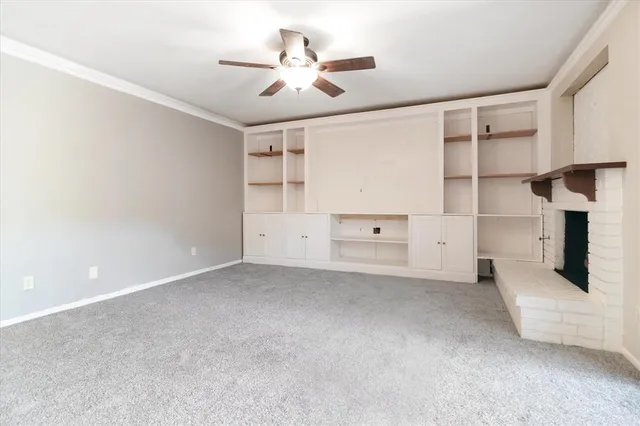 a kitchen with granite countertop a sink stove and cabinets