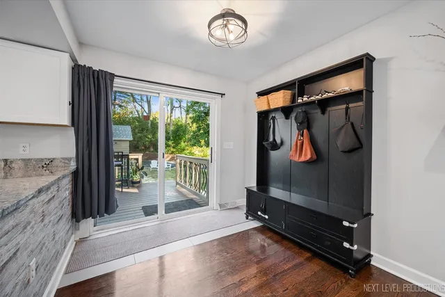 a view of an entryway with wooden floor